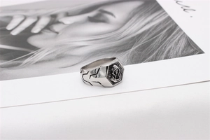 Detailed view of vintage hexagonal skull ring in silver stainless steel with punk style