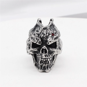 Retro gothic skull ring for men in vintage steel finish with a red gemstone eye