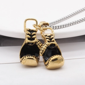 Retro stainless steel boxing glove pendant necklace with gold and black enamel details