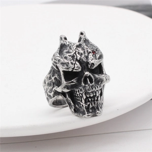 Vintage gothic skull ring in distressed stainless steel with a red gemstone eye detail