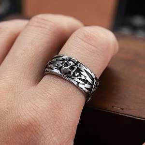Vintage stainless steel skull and crossbones ring with a distressed finish for men