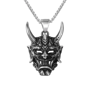 Retro Japanese Hannya mask pendant in titanium steel with detailed vintage carving