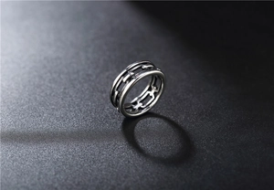Macro view of vintage stainless steel ring with industrial chain link design and matte finish
