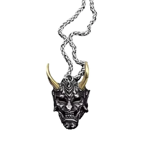 Japanese Hannya mask pendant in retro silver and gold horns on a woven chain