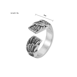 Detailed macro view of retro stainless steel wing ring showing 8mm width and texture