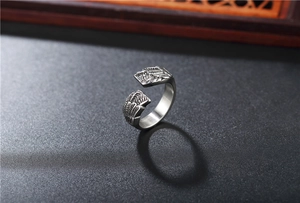 Macro shot of vintage titanium steel feather ring with adjustable open design and textures