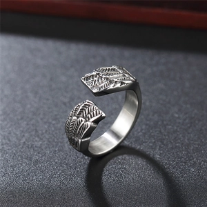 Vintage stainless steel open ring featuring detailed feather and angel wing textures