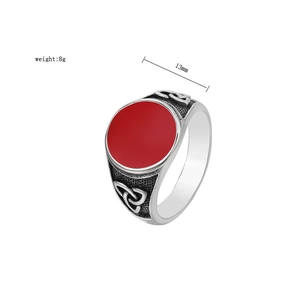 Detail of Viking ring with red gem inlay, trinity knot carvings and 13mm face width