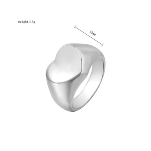 Detail showing polished heart signet ring with 12mm face width and 13g weight