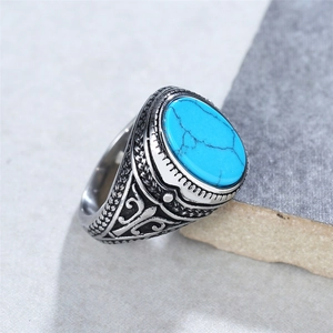 Bague vintage en acier inoxydable avec pierre turquoise ovale et motifs gravés