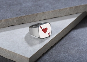 Detailed close-up of Ace of Hearts poker ring on stone surface for men