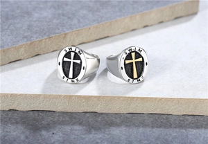 Detail of cross emblem and SWIM SINK engraving on stainless steel signet ring for men
