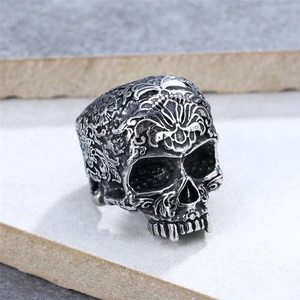 Punk vintage rock sugar skull ring in silver-toned stainless steel with floral engravings
