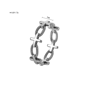 Detailed macro view showing the 5mm width and gothic cross pattern of the 2g steel ring