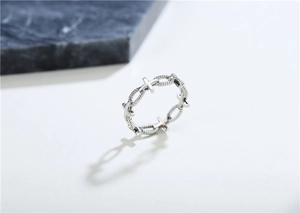 Close-up of gothic stainless steel ring with hollow chain and cross patterns