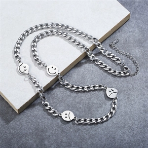 Minimalist stainless steel Cuban chain necklace with happy and sad face emoji pendants