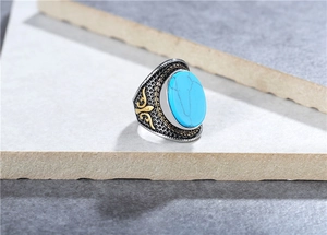 Detailed close-up of retro titanium steel ring featuring a turquoise stone and honeycomb pattern