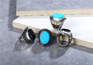 Detailed macro view of vintage men's titanium rings with turquoise and black onyx stones