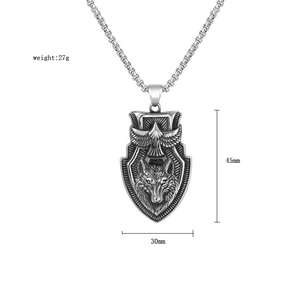 Detailed view of wolf and eagle relief pendant showing size 45mm by 30mm and weight 27g