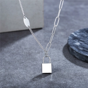 Chic silver titanium steel necklace featuring asymmetrical links and a polished lock pendant