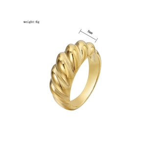 Macro shot of 8mm wide gold croissant twisted ring showing 6g weight and polished texture