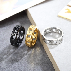 Cuban link cutout rings in black, gold, and silver finish on stone background