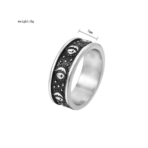 Detailed close-up of retro celestial patterns with sun and moon on 7mm titanium steel ring