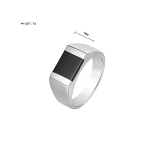 Close-up of titanium steel ring for men with black onyx inlay showing 8mm width and 7g weight