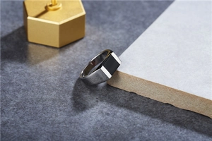 Minimalist silver steel signet ring with rectangular black enamel inlay on stone