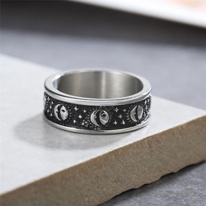 Vintage titanium steel ring with engraved sun, moon and star patterns in gothic style