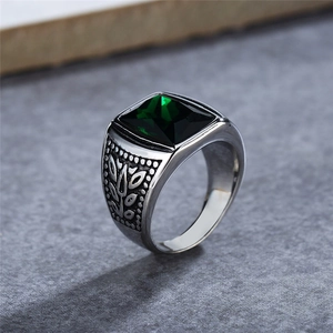 Vintage men's stainless steel ring with square emerald-cut green gemstone and leaf carvings