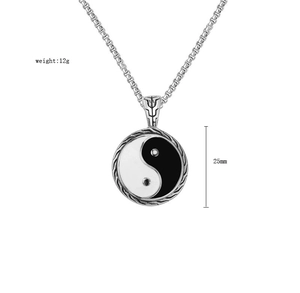 Detail of Yin Yang pendant with 25mm diameter and 12g weight on silver chain