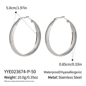 Macro detail of silver stainless steel hoop earrings showing 5.0cm outer diameter size