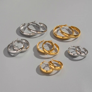 Size comparison of gold and silver polished stainless steel hoop earrings in three diameters
