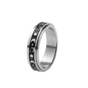 Stainless steel spinner ring with celestial sun moon and star patterns for anxiety relief