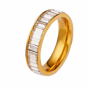 Detailed macro shot of a gold-plated stainless steel ring set with baguette-cut zircons
