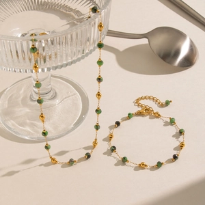 Elegant emerald green stone necklace and bracelet set with golden beads and stainless steel