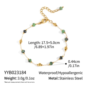 Detail of beaded necklace with emerald green natural stones and gold stainless steel chain