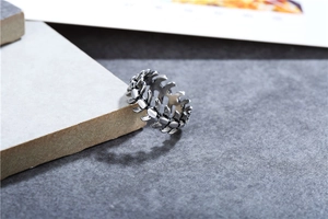 Detailed view of vintage punk style fish bone ring with antique stainless steel finish