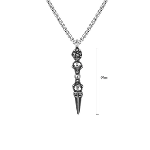 Macro shot of 60mm vintage steel Vajra pestle pendant with intricate wrathful deity carvings
