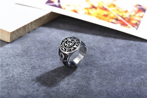 Macro detail of retro stainless steel ring with Eye of Horus and Ankh symbols