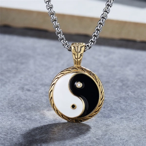 Yin Yang Tai Chi pendant necklace with gold textured frame and silver box chain