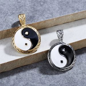 Vintage Yin Yang Tai Chi pendants in gold and silver stainless steel with black and white enamel