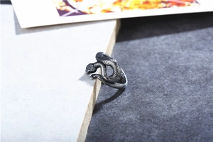 Macro shot of vintage snake ring showing detailed scales and antique silver finish