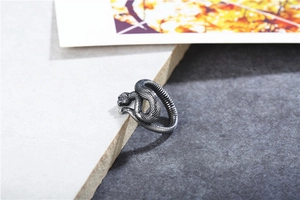 Macro detail of retro snake ring showing intricate scales and oxidized silver finish