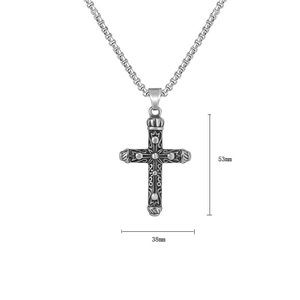 Detailed view of vintage steel cross pendant with crown relief measuring 53mm by 38mm