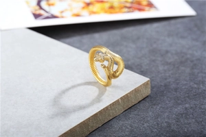 Close-up of golden snake ring showing intricate scale texture and vintage details