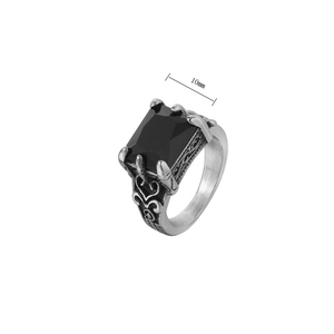 Macro detail of gothic signet ring with 10mm black gemstone and vine relief pattern