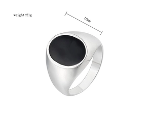 Detail view of silver stainless steel signet ring with black inlay, 16mm width and 21g weight