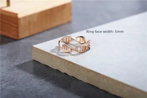 Detailed view of DNA double helix ring in rose gold with 5mm surface width spec